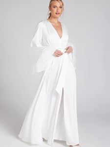 White slit dress with feathered sleeves
