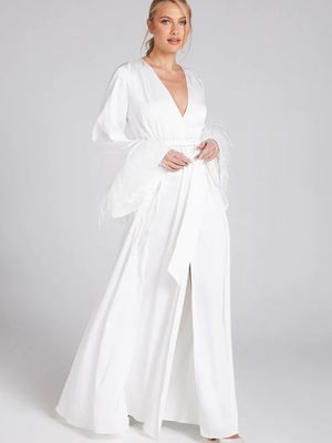 White slit dress with feathered sleeves